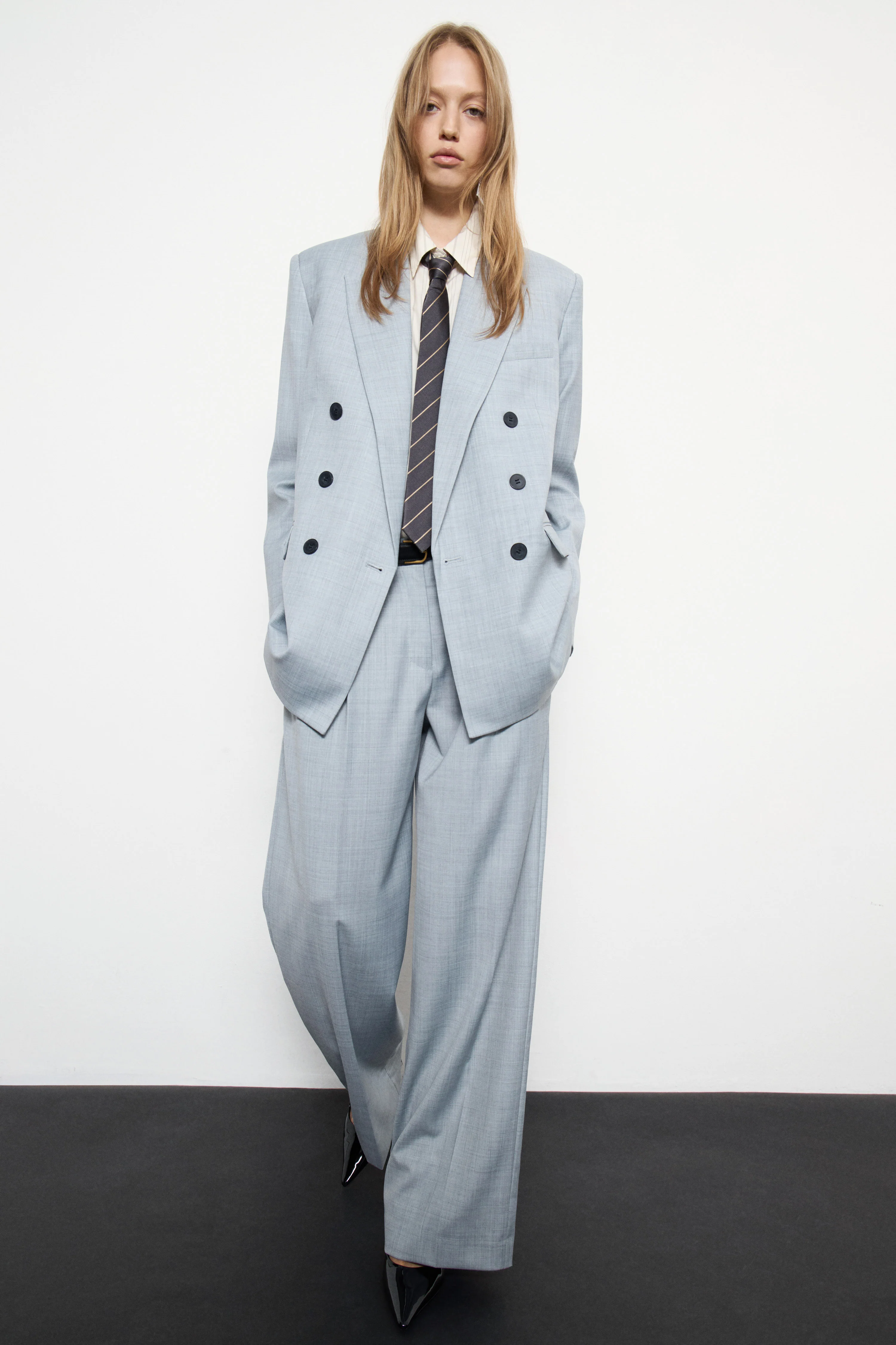 PLEATED WOOL-BLEND TROUSERS