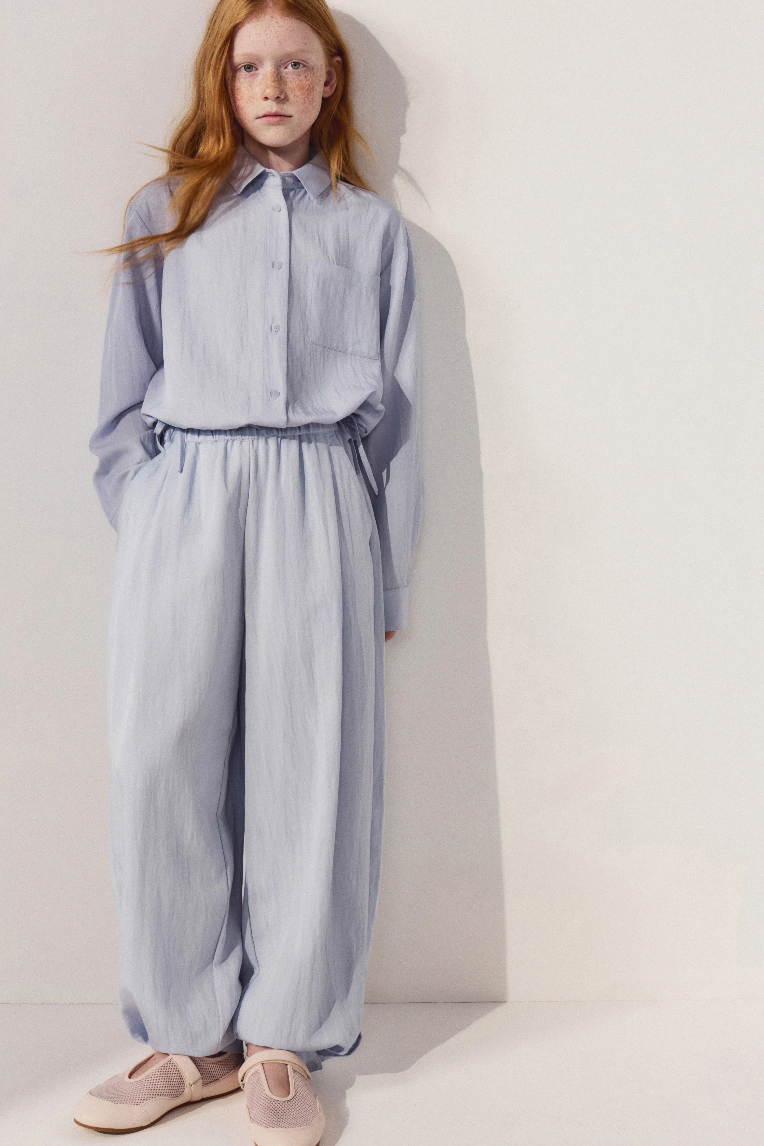 PLEATED BAGGY-FIT TROUSERS